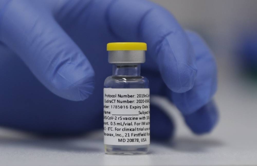 In this file photo, a vial of the Phase 3 Novavax coronavirus vaccine is seen ready for use in the trial at St. George's University hospital in London. AP PHOTO