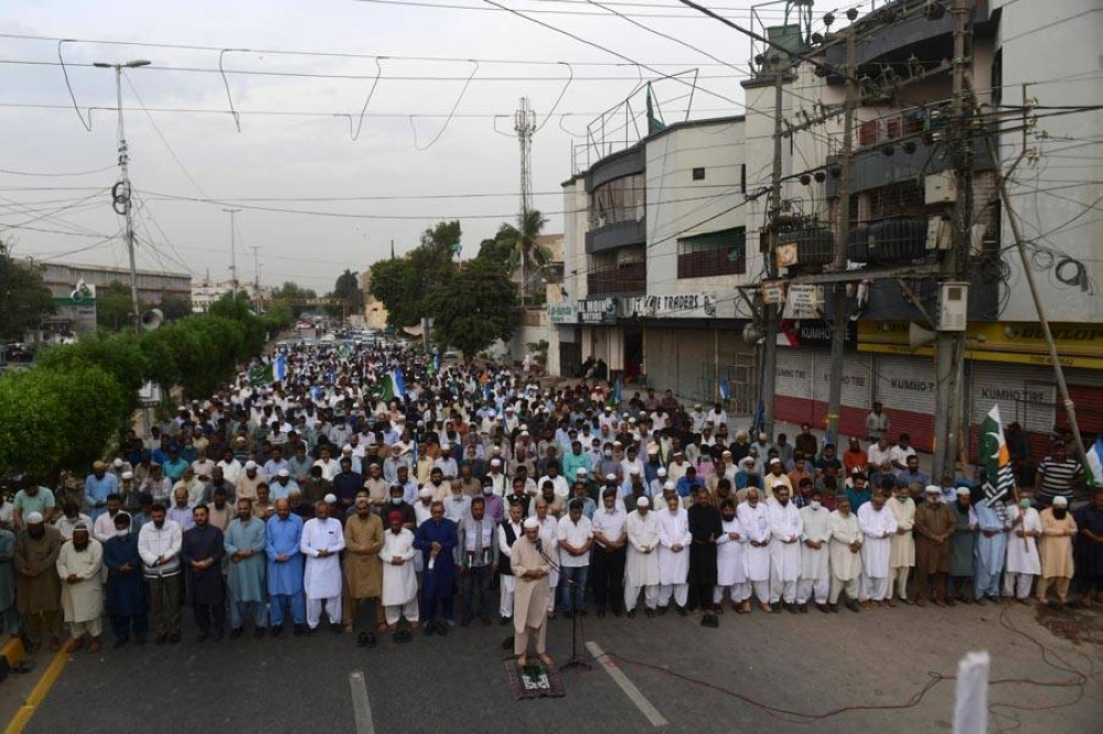 Pakistani Muslims offer funeral prayers on the death of Kashmiri separatist leader Syed Ali Shah Geelani, in Karachi on September 2, 2021. AFP PHOTO