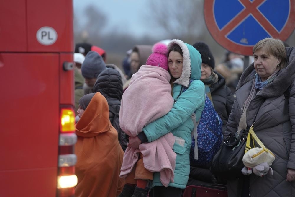 WAITING TO LEAVE Refugees, mostly women with children, wait for transportation at the border crossing in Medyka, Poland, on Saturday, March 5, 2022, after fleeing from Ukraine, which is under attack from Russian forces. AP PHOTO