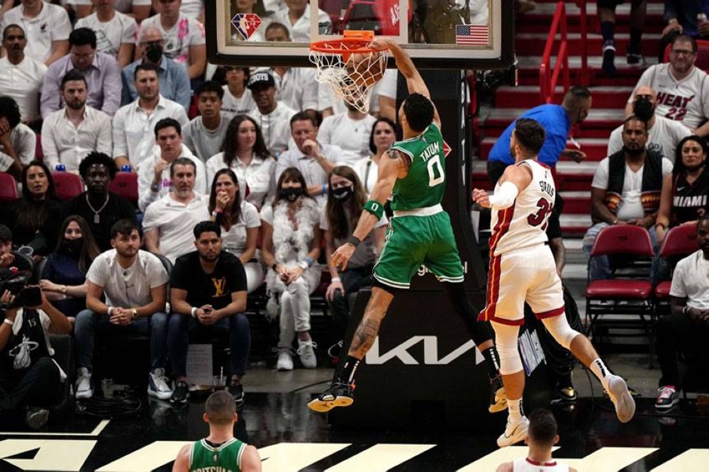 Boston Celtics' Jayson Tatum dunks against the Miami Heat during