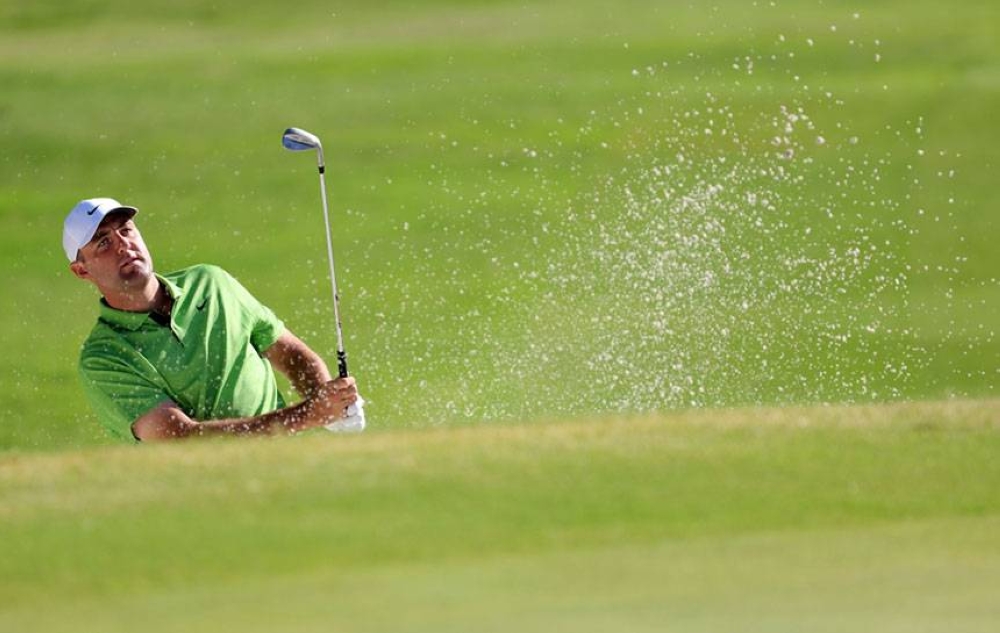 Scottie Scheffler of the United States plays a shot from a bunker on the 12th hole during the first round of the Charles Schwab Challenge at Colonial Country Club, on Thursday, May 26, 2022 (May 27 in Manila), in Fort Worth, Texas. AFP PHOTO