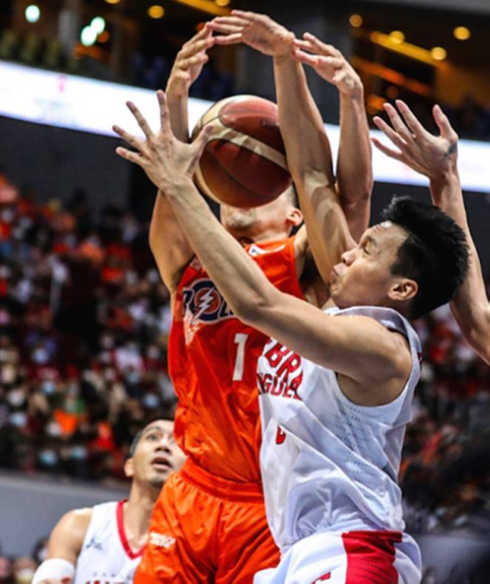 Meralco’s Aaron Black (No. 1) and Barangay Ginebra’s Scottie Thompson battle for the rebound during the PBA Season 46 finals on April 23, 2022 at the Mall of Asia Arena in Pasay City. PBA PHOTO