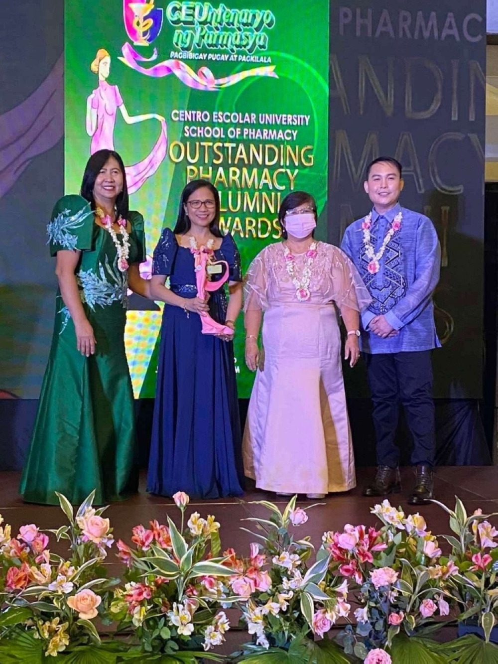 EXCELLENCE Photo shows Lanette Acoba Querubin (2nd from left) with Dr. Cecilia Santiago, dean of CEU’s School of Pharmacy (extreme left), Dr. Ma. Flordeliza Anastacio, vice president of CEU-Malolos, Bulacan (3rd from left) and Niño Bautista, executive vice president of CEU Alumni Foundation Inc. Pharmacy Chapter. CONTRIBUTED PHOTO