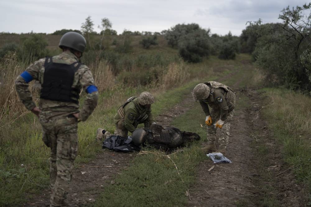 Near the Russian border, bodies still lie on the battlefield | The ...