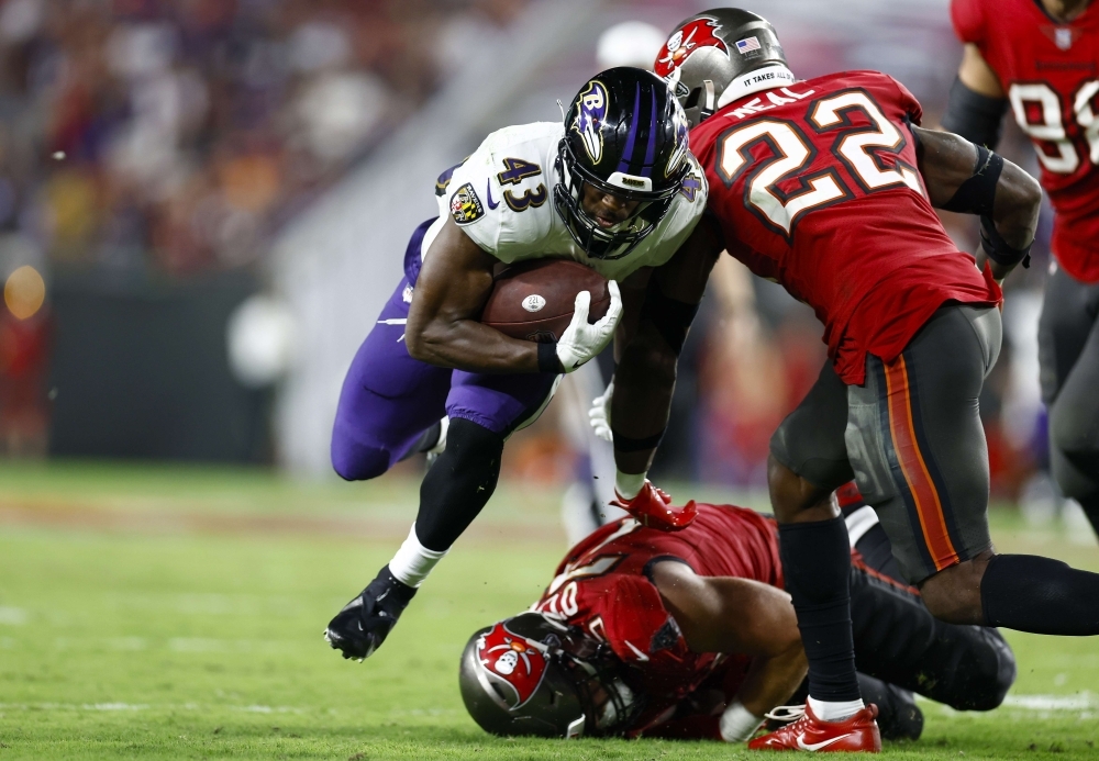 Tampa Bay Buccaneers Safety Keanu Neal hustles down field in kick