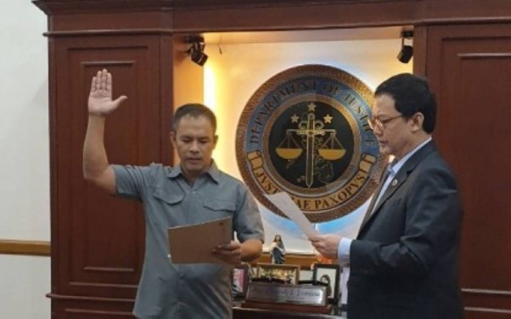 GOOD OLD DAYS Gerald Bantag takes his oath as head of the Bureau of Corrections before Justice Secretary Menardo Guevarra in this photo taken on Sept. 20, 2019. DEPARTMENT OF JUSTICE PHOTO