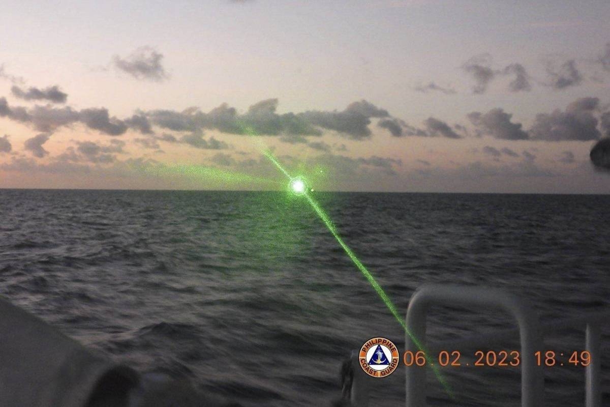 This photo provided by the Philippine Coast Guard shows a green military-grade laser light from a Chinese coast guard ship in the disputed South China Sea, Monday, Feb. 6, 2023. PHOTO BY THE PHILIPPINE COAST GUARD VIA AP