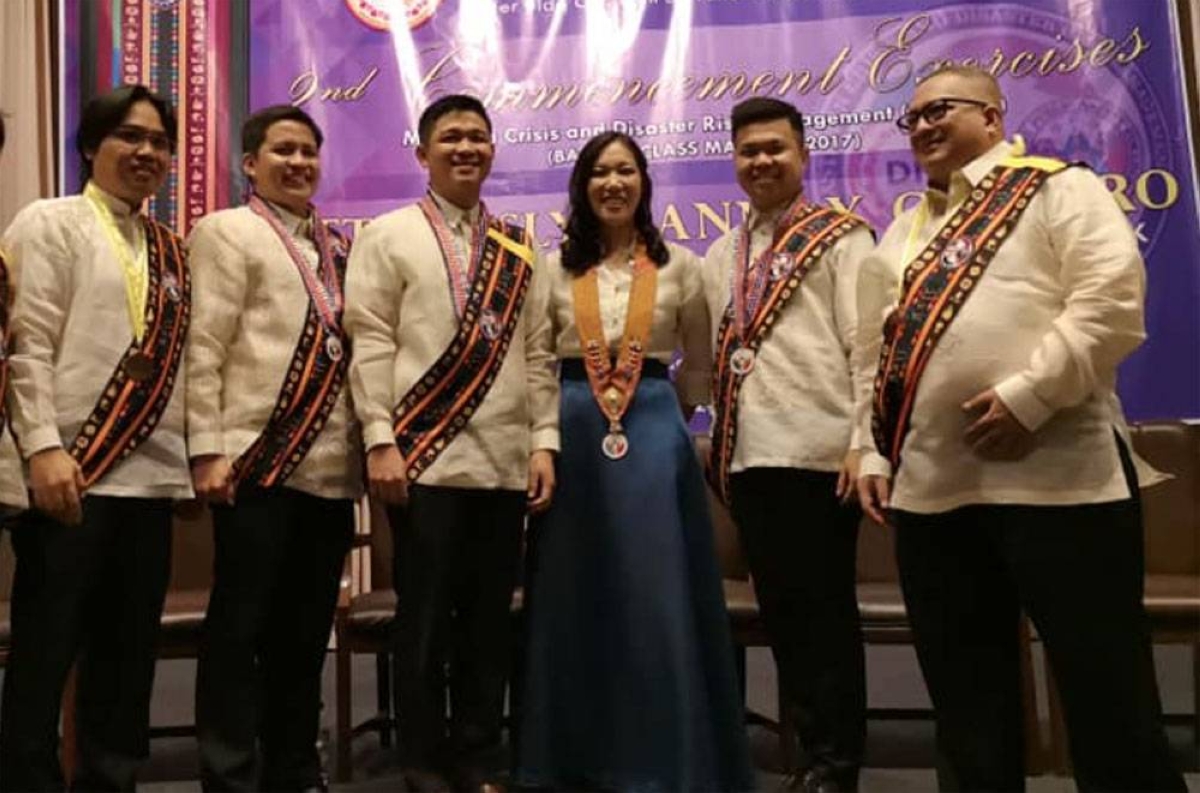 BEST AND BRIGHTEST Lesley Jeane Cordero — one of the most sought-after subject-matter expert in disaster risk management in the Asian region — together with the honors graduates (left photo) of the Master in Crisis and Disaster Risk Management program of the Philippine Public Safety College. CONTRIBUTED PHOTOS