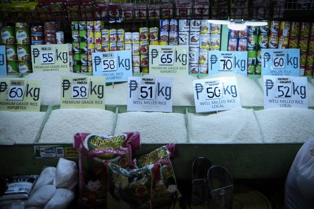 Rice retailers inside the Pasay City Public Market in Libertad, Pasay wait for consumers during the first day of the implementation of Executive Order 39, or the Imposition of Mandated Price Ceilings on Rice. According to the rice retailers, it is impossible for them to follow the Php 41 price cap since they buy the rice from traders at a minimum of around Php 45 per kilogram. PHOTO BY J. GERARD SEGUIA