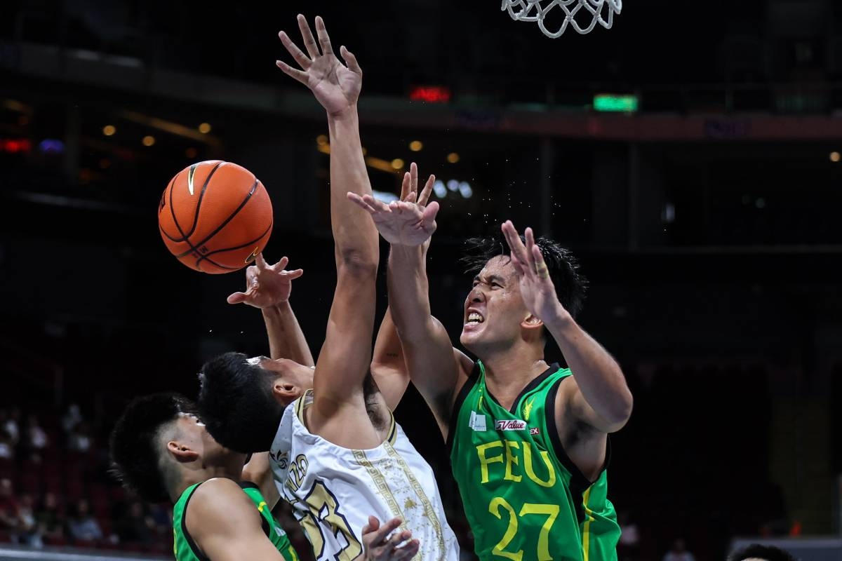  FEU’s Miguel Ona (No. 27) and Cholo Añonuevo stop NU's Mike Malonzo from scoring during the UAAP Season 86 men's basketball at the Mall of Asia Arena in Pasay, October 4, 2023. PHOTO BY RIO DELUVIO