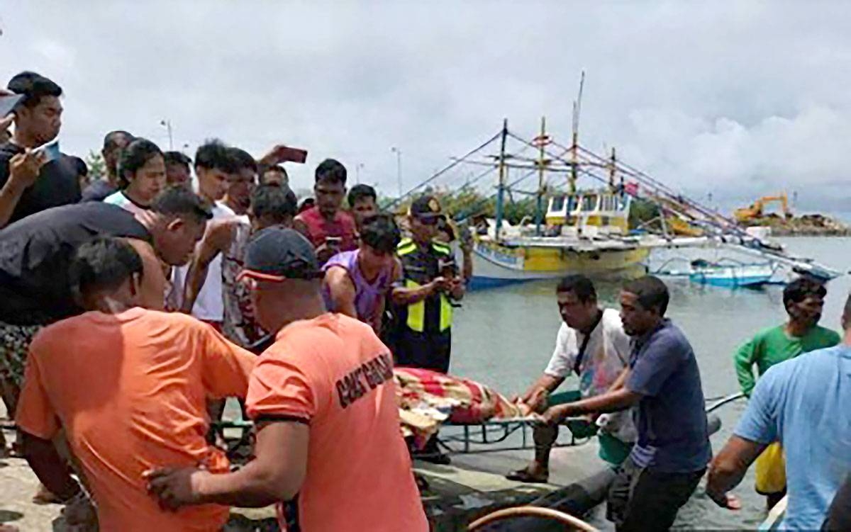 TRAGEDY The body of one of the three Filipino fishermen is transported to Barangay Cato, Infanta, Pangasinan on Tuesday Oct. 3, 2023. Photo courtesy of Philippine Coast Guard