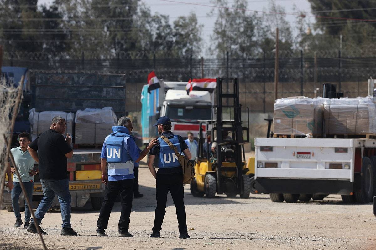 HELP HAS COME The first of 20 trucks carrying humanitarian aid enter the war-torn and besieged Gaza Strip from Egypt via the Rafah border crossing on Friday, Oct. 21, 2023, as United Nations Aid workers gather to meet them. AFP PHOTO 