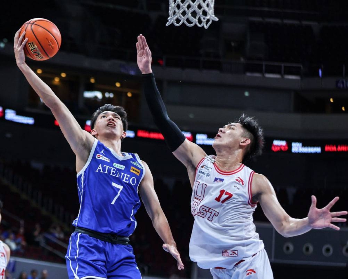 Ateneo’s Jason Credo goes up against UE’s Abdul Sawat during the UAAP ...