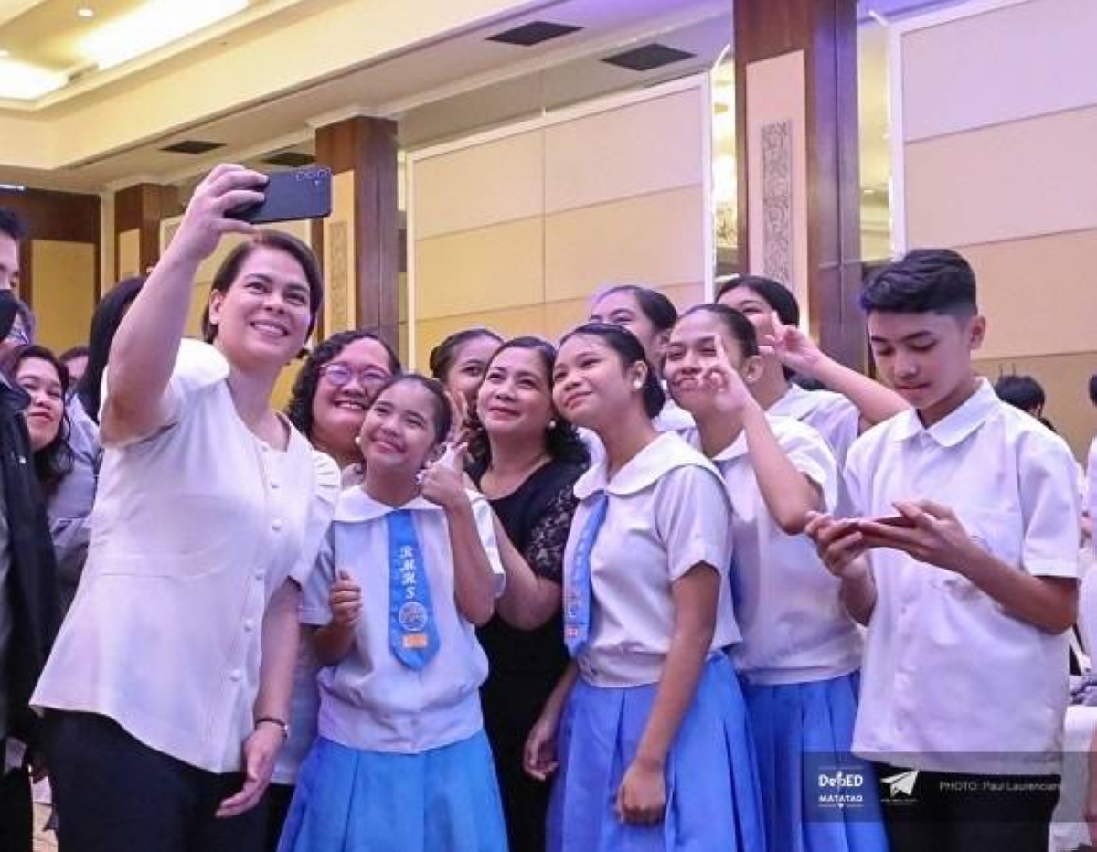 Vice President Sara Duterte poses with students and Education officials during the culmination of the observance of National Children’s Month on Nov. 27,2023.