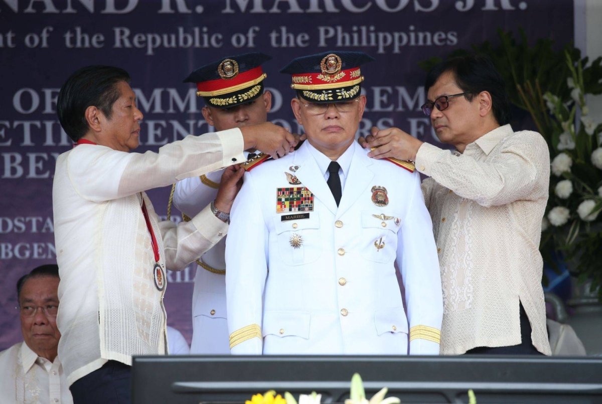 CHANGE OF COMMAND President Ferdinand Marcos Jr. and Interior Secretary Benjamin Abalos Jr. with Philippine National Police chief Maj. Gen. Rommel Francisco Marbil. PHOTO BY RENE H. DILAN