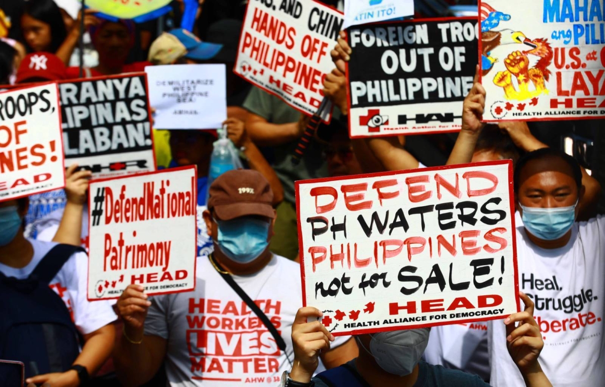 Protesters hold an effigy of Chinese President Xi Jin Ping in front of the Chinese Embassy in Makati City on Tuesday, April 9, 2024 as they condemn Beijing's repeated harassment of Filipino fisherfolk and Philippine supply missions in the West Philippine Sea. PHOTO BY MIKE ALQUINTO