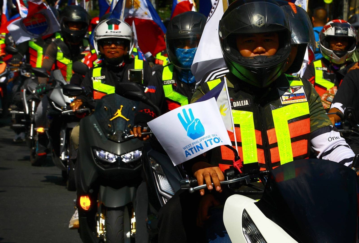 Protesters hold an effigy of Chinese President Xi Jin Ping in front of the Chinese Embassy in Makati City on Tuesday, April 9, 2024 as they condemn Beijing's repeated harassment of Filipino fisherfolk and Philippine supply missions in the West Philippine Sea. PHOTO BY MIKE ALQUINTO