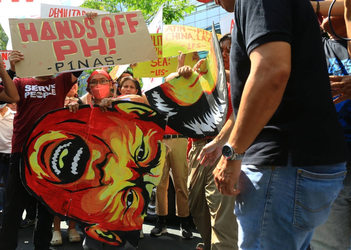 Protesters hold an effigy of Chinese President Xi Jin Ping in front of the Chinese Embassy in Makati City on Tuesday, April 9, 2024 as they condemn Beijing's repeated harassment of Filipino fisherfolk and Philippine supply missions in the West Philippine Sea. PHOTO BY MIKE ALQUINTO