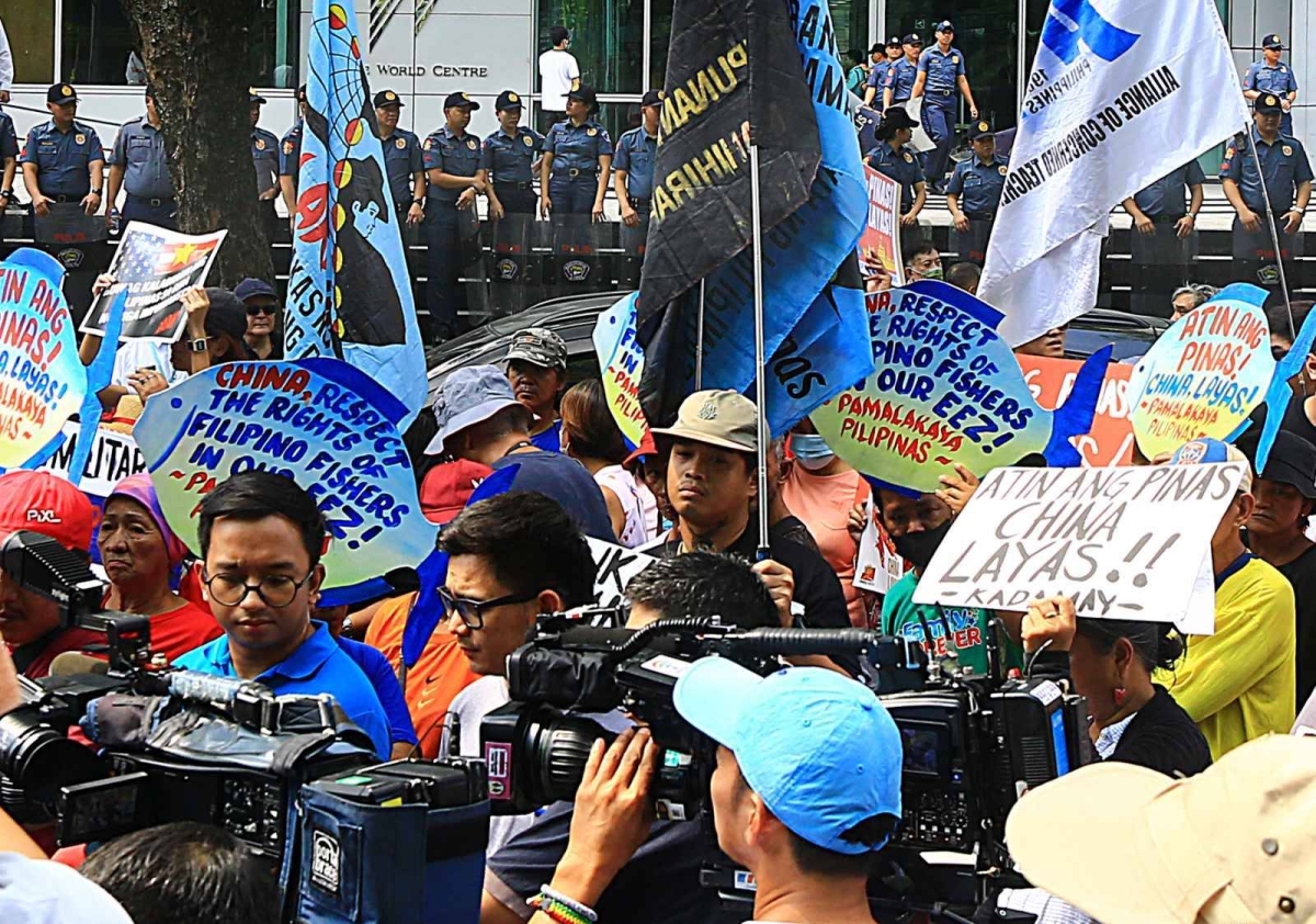 Protesters hold an effigy of Chinese President Xi Jin Ping in front of the Chinese Embassy in Makati City on Tuesday, April 9, 2024 as they condemn Beijing's repeated harassment of Filipino fisherfolk and Philippine supply missions in the West Philippine Sea. PHOTO BY MIKE ALQUINTO