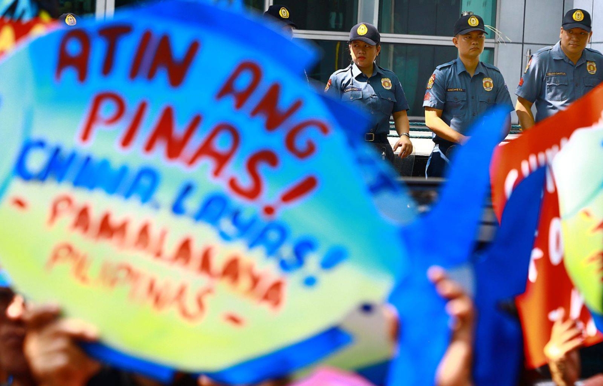 Protesters hold an effigy of Chinese President Xi Jin Ping in front of the Chinese Embassy in Makati City on Tuesday, April 9, 2024 as they condemn Beijing's repeated harassment of Filipino fisherfolk and Philippine supply missions in the West Philippine Sea. PHOTO BY MIKE ALQUINTO