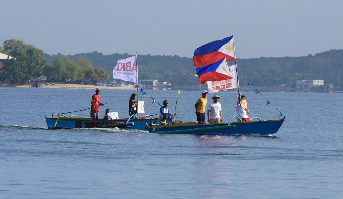 Fisherfolk from Zambales lead a fluvial parade in the West Philippine Sea off Candelaria, on Saturday, May 11, 2024, to express their condemnation of the continuous harassment by the Chinese Coast Guard of Filipino fishers within the Philippines' Exclusive Economic Zone (EEZ), and to show solidarity with President Ferdinand Marcos Jr and fellow Filipinos in asserting sovereign rights in the West Philippine Sea.
PHOTOS BY ISMAEL DE JUAN