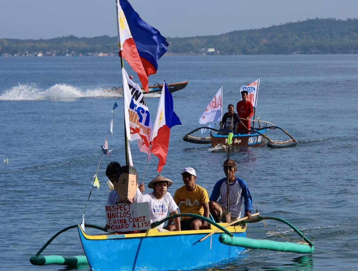 Fisherfolk from Zambales lead a fluvial parade in the West Philippine Sea off Candelaria, on Saturday, May 11, 2024, to express their condemnation of the continuous harassment by the Chinese Coast Guard of Filipino fishers within the Philippines' Exclusive Economic Zone (EEZ), and to show solidarity with President Ferdinand Marcos Jr and fellow Filipinos in asserting sovereign rights in the West Philippine Sea.
PHOTOS BY ISMAEL DE JUAN