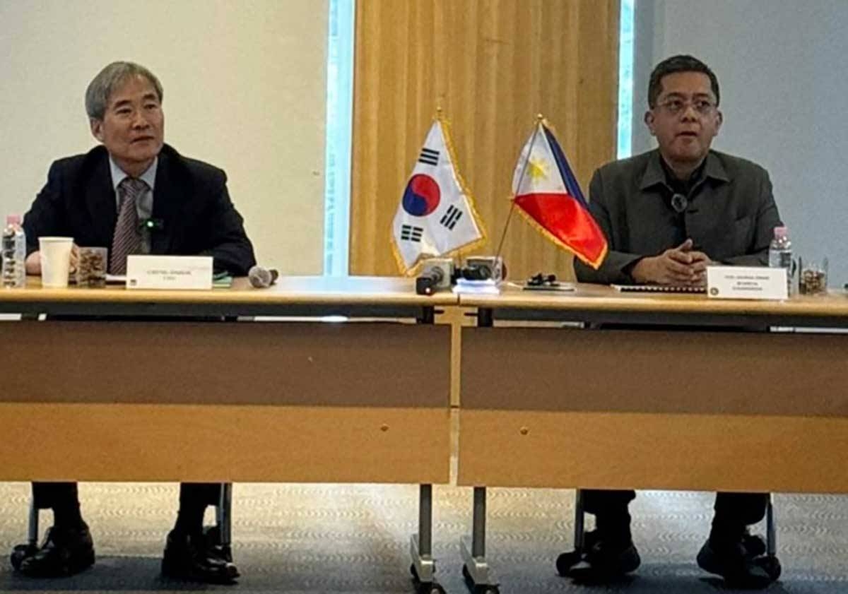 POLL PARTNERS Miru Systems Co. Ltd. President Jinbok Chung (left) and Commission on Elections Chairman George Erwin Garcia meet in South Korea where the technology firm conducted a tour of its factory for the poll officials and Philippine media on June 10, 2024. PHOTO BY LYNETTE O. LUNA