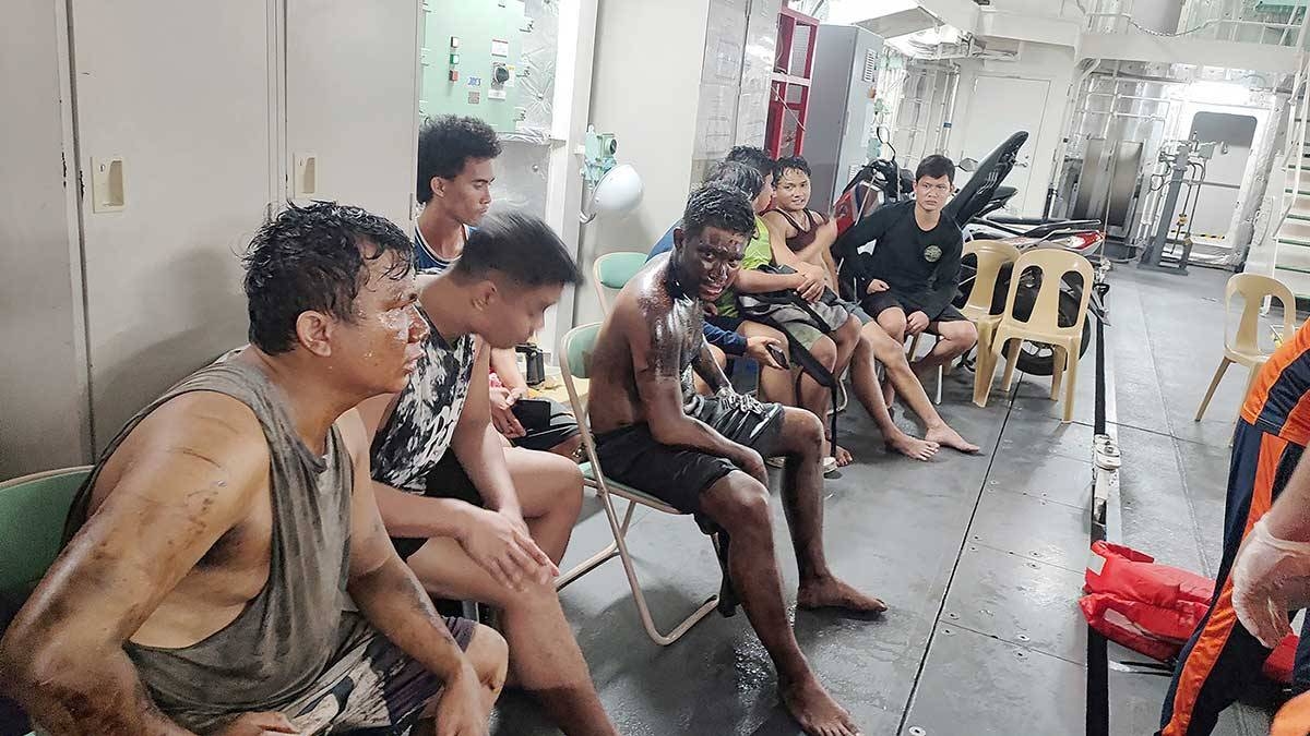 RESCUED CREW This handout photo taken on July 25, 2024, received from the Philippine Coast Guard, shows the rescued crew of oil tanker MT Terra Nova receiving first aid aboard Coast Guard ship Melchora Aquino off Manila Bay. AFP PHOTO