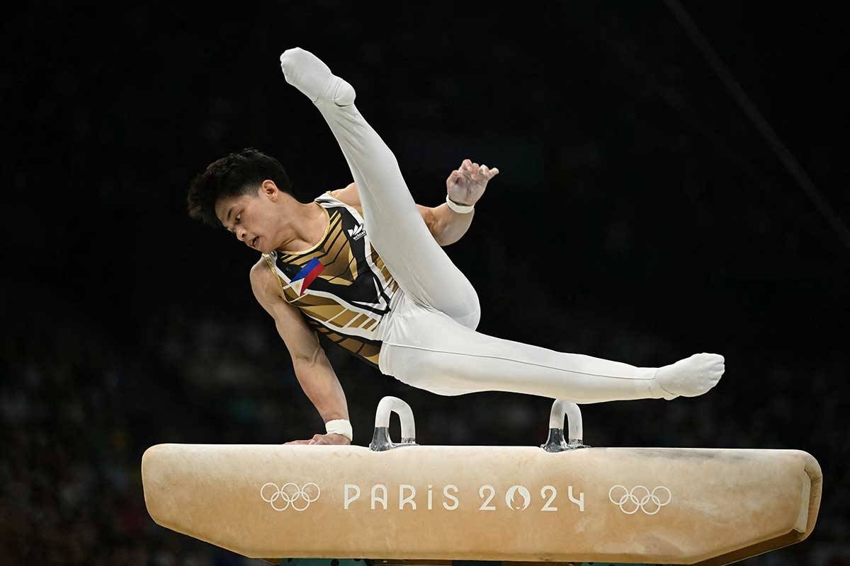 Philippines' Carlos Edriel Yulo competes in the pommel horse event of the artistic gymnastics men's all-around final during the Paris 2024 Olympic Games at the Bercy Arena in Paris, on July 31, 2024. (Photo by Paul ELLIS / AFP) 