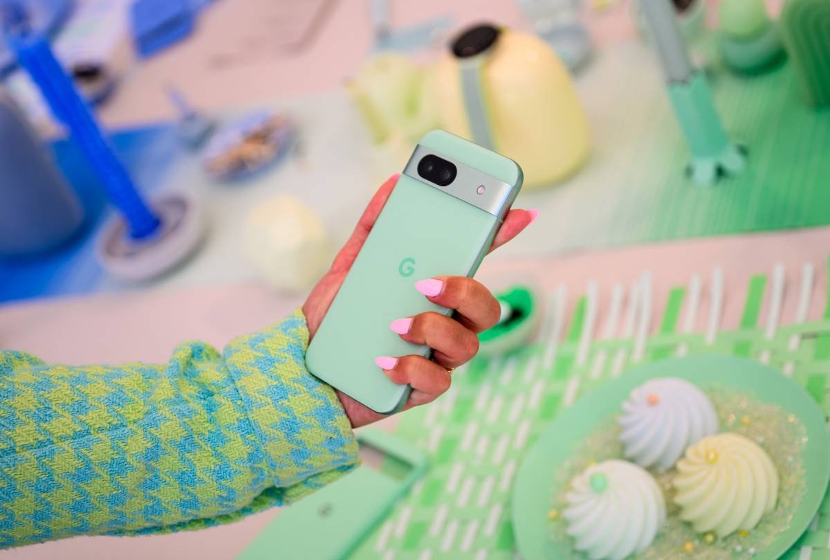 Katarina Mogus takes a photo with a new Pixel phone during the Made By Google event at Google's Bay View campus in Mountain View, California, on August 13, 2024. AFP PHOTO