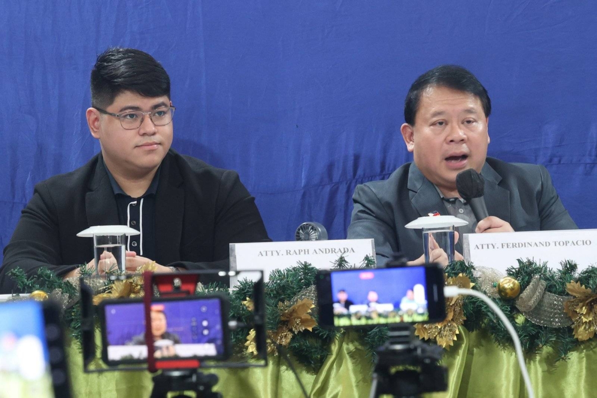 Lawyer Ferdinand Topacio (center) shows an undated photo of President Ferdinand Marcos Jr. (center), together with Rainer Tiu (right) during a press conference in Quezon City on Sept. 7, 2024. Tiu is allegedly 'king' of the Philippine Offshore Gaming Operators (POGOs). Topacio is the lawyer of dismissed town mayor Alice Guo, who has since been deported from Indonesia where she was arrested and has been placed under the custody of the Philippine National Police (PNP). Guo has been linked to illegal POGO operations in her hometown. She is facing multiple charges of money laundering and of fraud, misrepresenting herself as a Filipino. Malacañang has yet to respond to Topacio's disclosure. PHOTOS BY JOHN ORVEN VERDOTE