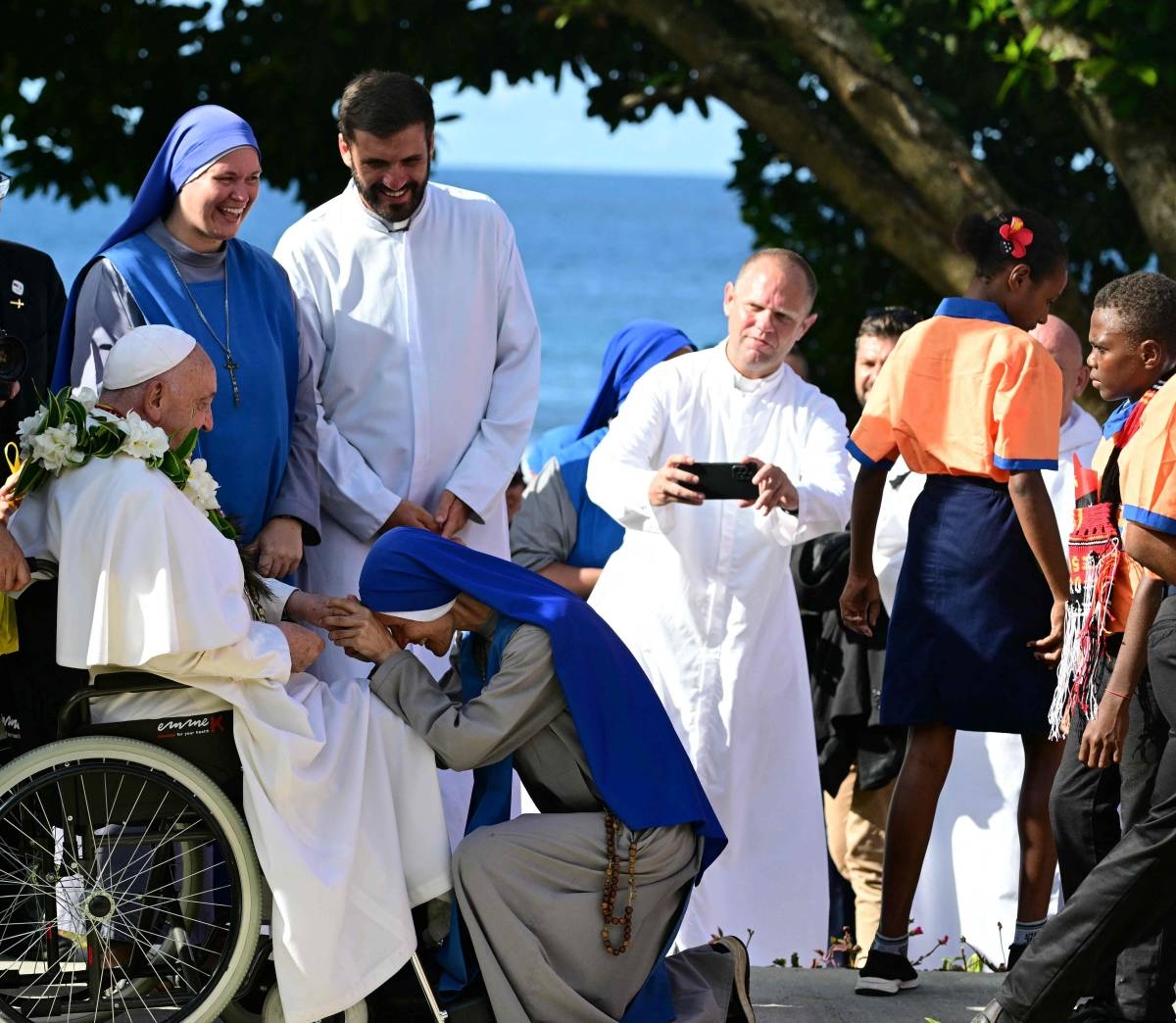 PAYING HOMAGE Pope Francis blesses a nun during a meeting with missionaries in the Holy Trinity Humanities School during a visit in Baro, Papua New Guinea, on Sept. 8, 2024. AFP PHOTO