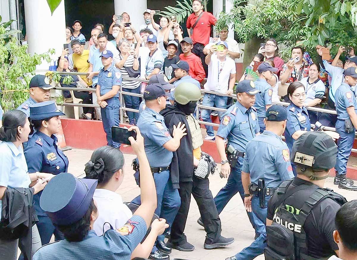 WELL PROTECTED Pastor Apollo Quiboloy, the self-proclaimed “Son of God,” is brought to the Pasig Court of First Instance to enter a “not guilty” plea on charges including child abuse and sex trafficking on September 13, 2024. Aside from the heavy security, the founder of the Kingdom of Jesus Christ wore a helmet and a bulletproof vest. PHOTO BY ISMAEL DE JUAN