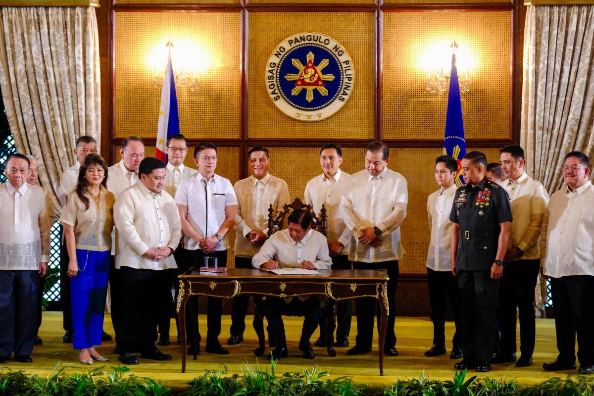 Marcos signs new defense law