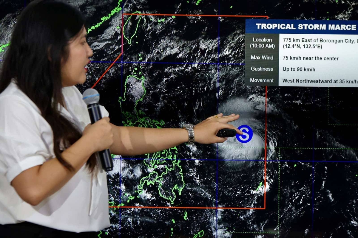 Weather forecaster Veronica Torres provides an update on Typhoon Mars tracking hours after it entered the Philippine area of ​​responsibility. PHOTOS BY ISMAEL DE JUAN