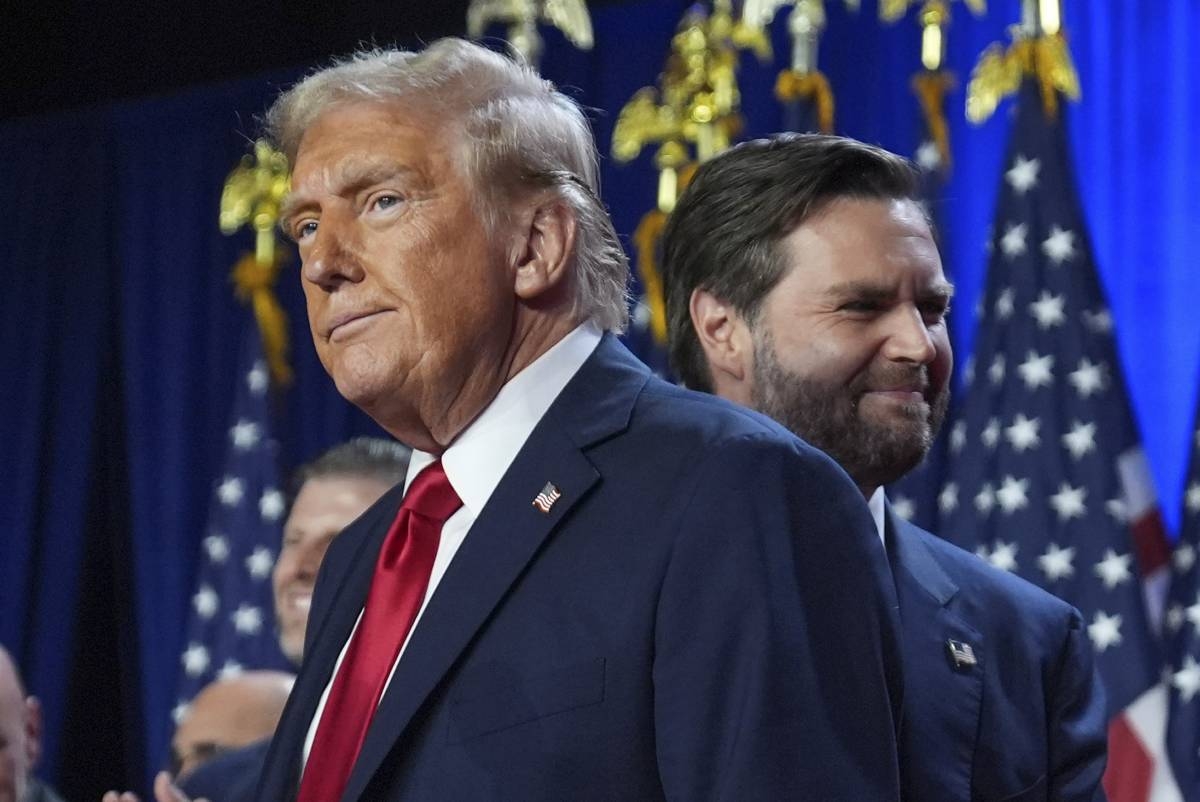 Republican presidential nominee former President Donald Trump and his running mate Sen. JD Vance, R-Ohio, stand on stage at an election night watch party at the Palm Beach Convention Center, Wednesday, Nov. 6, 2024, in West Palm Beach, Florida. AP PHOTO 