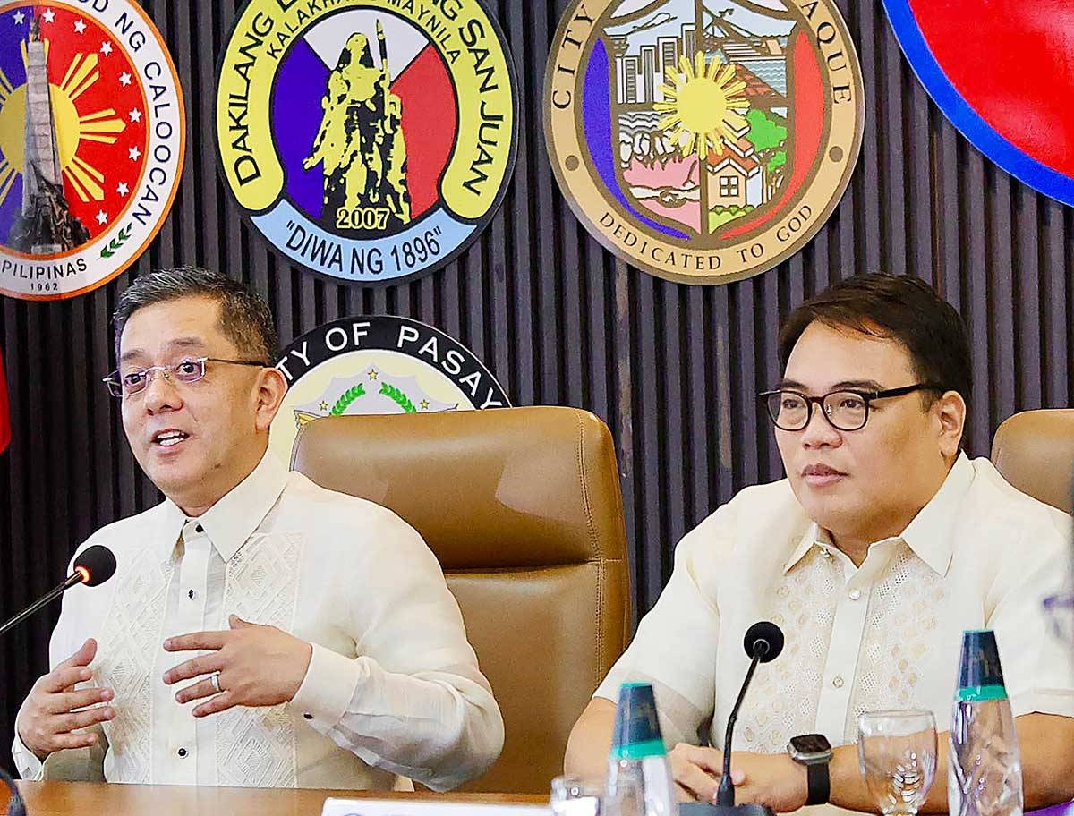 PARTNERS Commission on Elections Chairman George Erwin Garcia and Metropolitan Manila Development Authority Chairman Romando Artes discuss the provisions of the agreement they signed on Nov. 12, 2024, in Pasig City. PHOTO BY ISMAEL DE JUAN