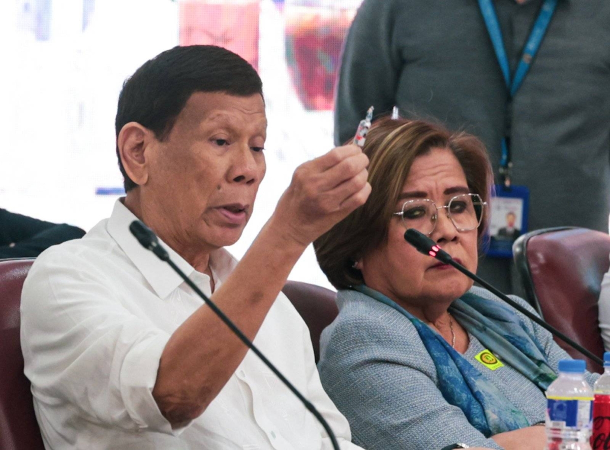 SITTING WITH THE ENEMY Former president Rodrigo Duterte and former senator Leila de Lima find themselves seated beside each other on Nov. 13, 2024 during the resumption of an inquiry at the House of Representatives on the drug war launched by the ex-leader during his term. It was Duterte who jailed de Lima on drug charges but which were dismissed seven years after. PHOTO BY JOHN ORVEN VERDOTE