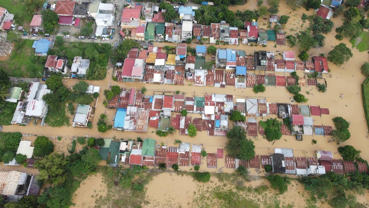 WATER WORLD Houses in Alibagu village in Ilagan City, Isabela, are submerged in floodwater on Nov. 18, 2024, a day after Super Typhoon Pepito's onslaught in Luzon. Isabela residents lived through five typhoons that ravage province in less than two months. PHOTO BY VINCE JACOB VISAYA 