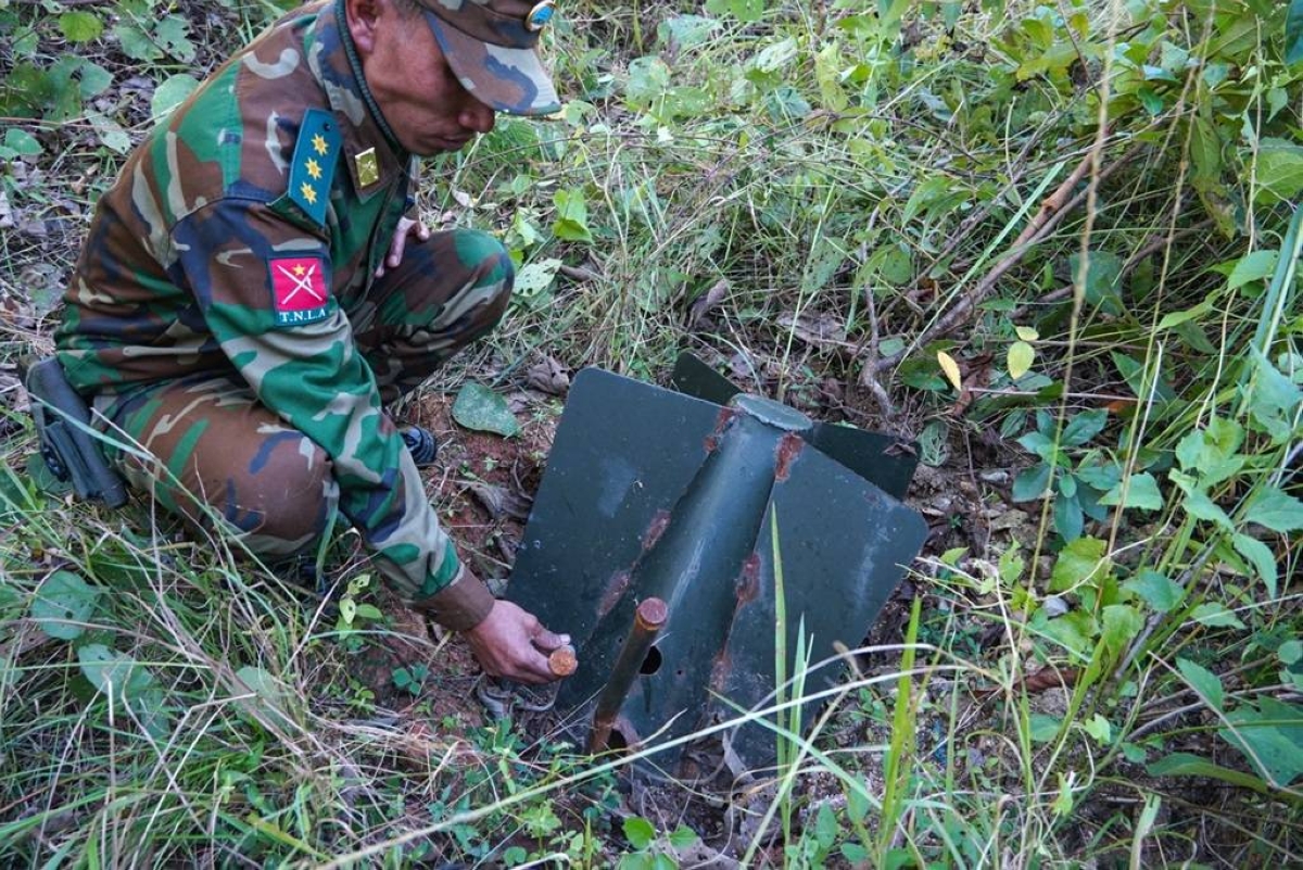 THREAT TO LIFE AND LIMB A member of the Ta'ang National Liberation Army (TNLA) shows an unexploded ordnance planted by Myanmar’s military in Mantong town, northern Shan State, on Nov. 17, 2024. AFP PHOTO 