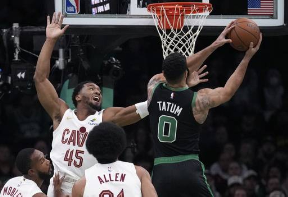 ON A MISSION Boston Celtics forward Jayson Tatum (0) drives to the basket against Cleveland Cavaliers guard Donovan Mitchell (45) during the first half of an Emirates NBA Cup basketball game on Nov. 19, 2024, in Boston.  AP PHOTO