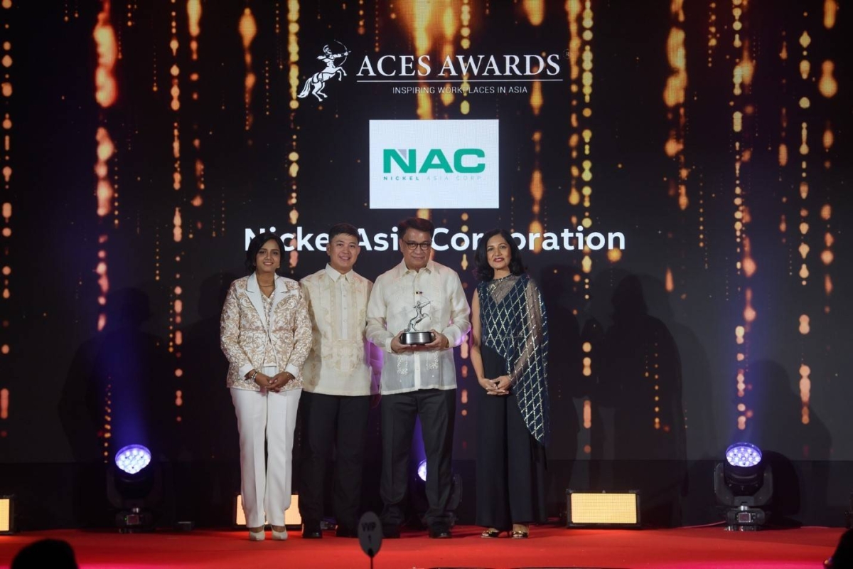 Vice President for Corporate Affairs and Community Relations Ryan Rene Jornada (2nd from left) and Senior Vice President for Sustainability, Risk, Corporate Affairs, and Communications Jose Bayani Baylon (2nd from right) receive Nickel Asia Corp.’s award for being an inspiring workplace in Asia. PHOTO FROM NICKEL ASIA CORP.