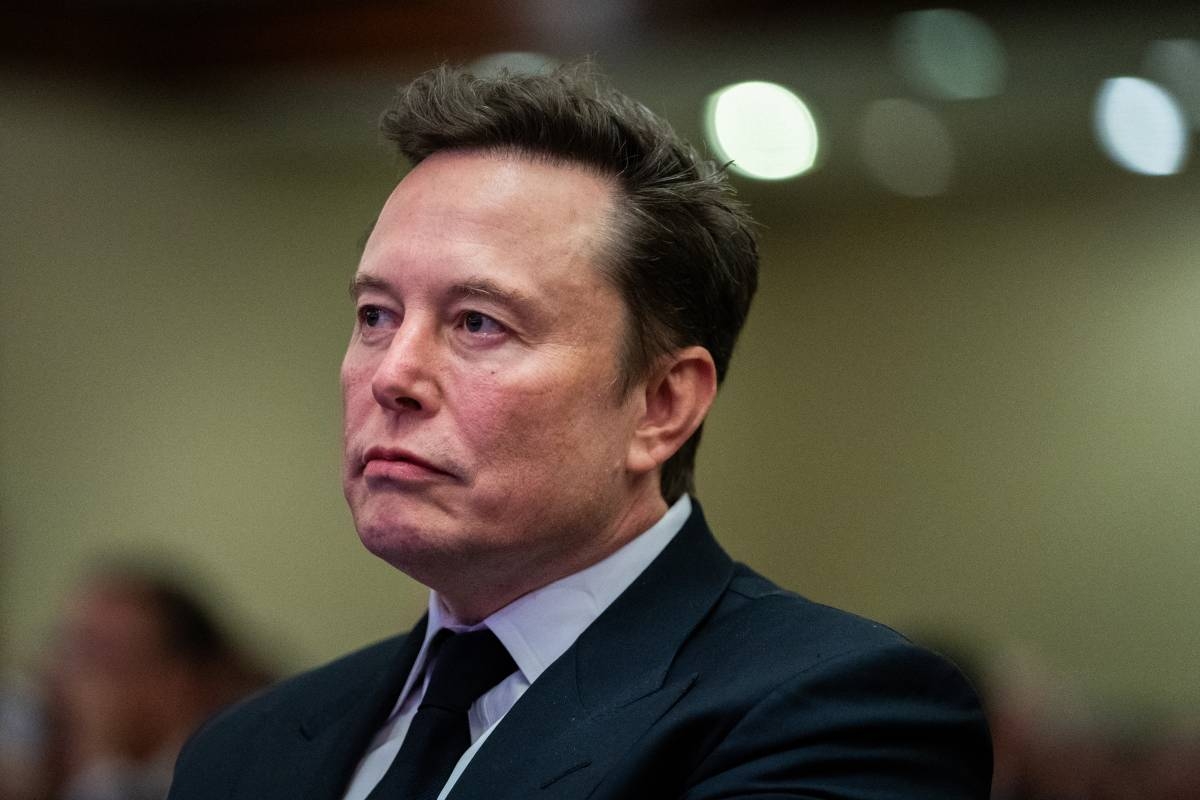 WASHINGTON, DC - NOVEMBER 13: Elon Musk listens as US President-elect Donald Trump speaks during a House Republicans Conference meeting at the Hyatt Regency on Capitol Hill on November 13, 2024 in Washington, DC. As is tradition with incoming presidents, President-elect Trump is traveling to Washington, DC to meet with U.S. President Joe Biden at the White House as well as Republican members of Congress on Capitol Hill.   Allison Robbert-Pool/Getty Images/AFP (Photo by POOL / GETTY IMAGES NORTH AMERICA / Getty Images via AFP)