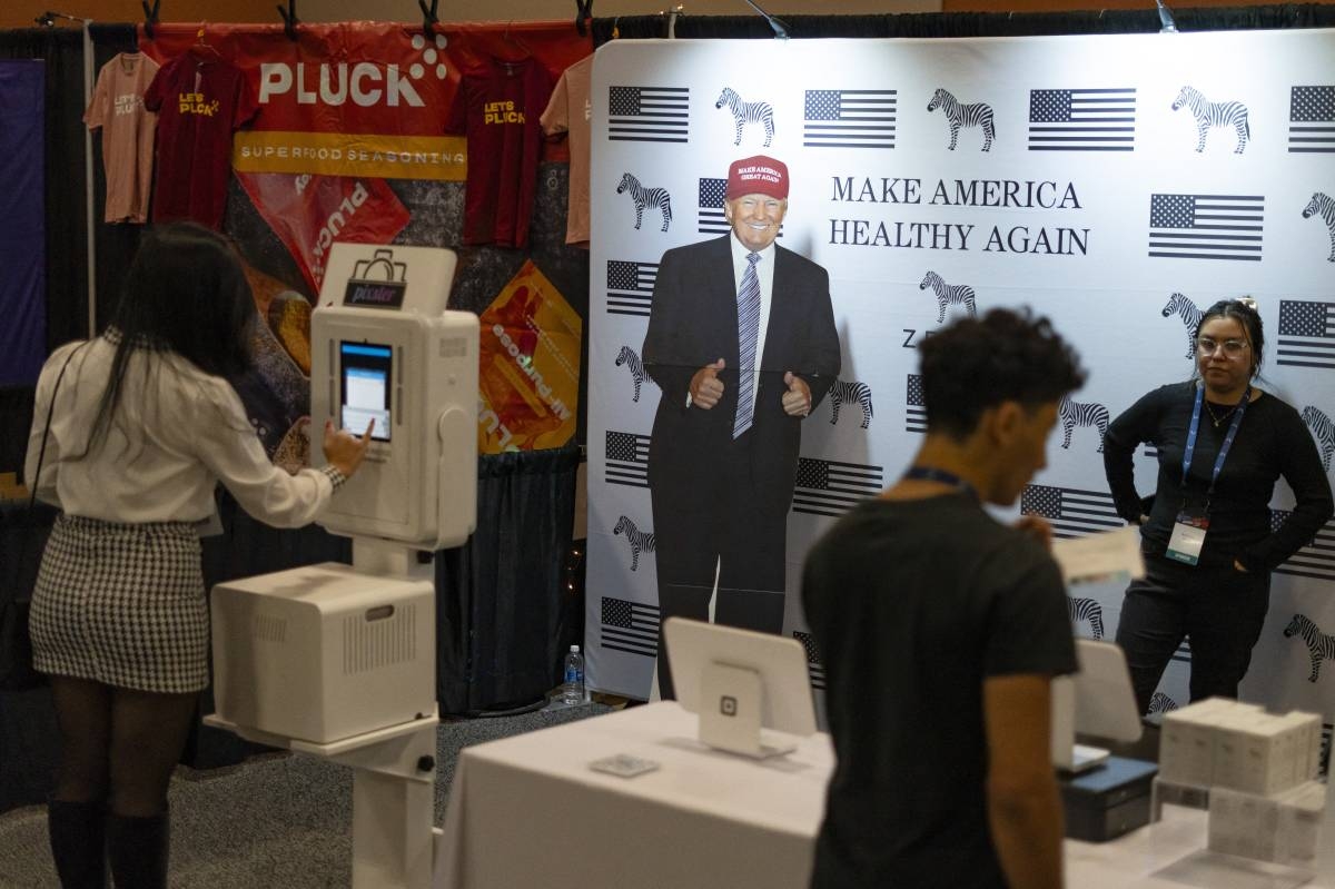 PHOENIX, ARIZONA - DECEMBER 21: A cardboard cutout of President-elect Donald Trump stands next to a backdrop that reads "make America healthy again" during Turning Point USA's AmericaFest at the Phoenix Convention Center on December 20, 2024 in Phoenix, Arizona. The annual four day conference geared toward energizing and connecting conservative youth hosts some of the country's leading conservative politicians and activists. Rebecca Noble/Getty Images/AFP (Photo by Rebecca Noble / GETTY IMAGES NORTH AMERICA / Getty Images via AFP)