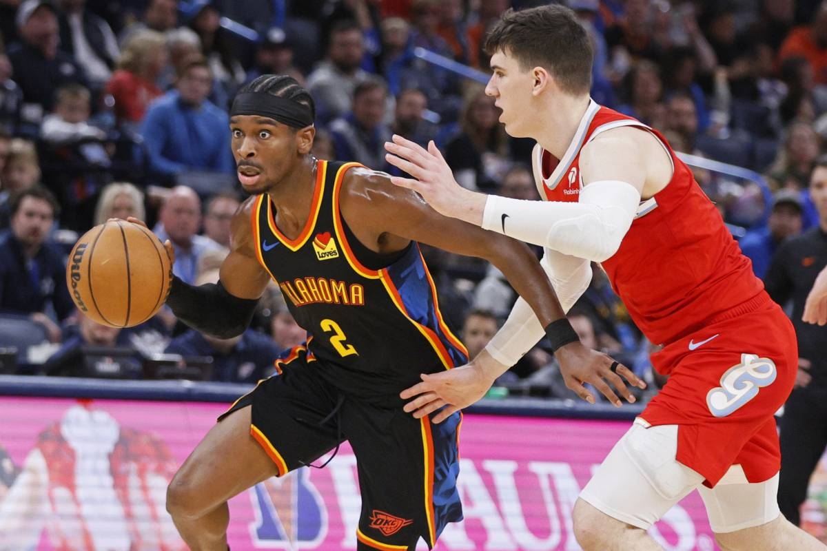 Oklahoma City Thunder guard Shai Gilgeous-Alexander (2) drives past Memphis Grizzlies forward Jake LaRavia, right, during the first half of an NBA basketball game Sunday, Dec. 29, 2024, in Oklahoma City. AP PHOTO 