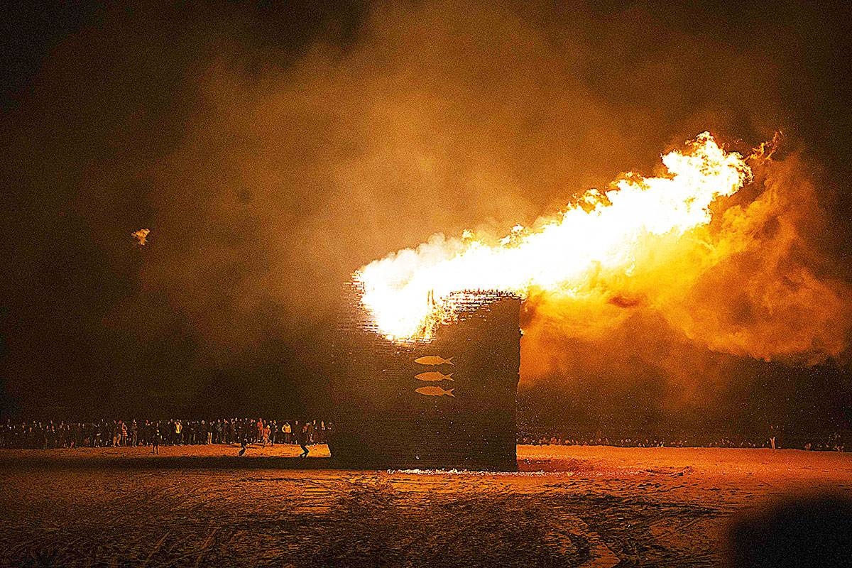 NEW YEAR TRADITION Wooden pallets making up a wooden mound burn during the annual bonfire on New Year’s eve, on the beach of Scheveningen in the Hague, on Dec. 30, 2024. The wood structure on The Hague beach is traditionally set alight at the turn of the year, but due to the expected bad weather conditions, the bonfire has been lit a day earlier. PHOTO BY LINA SELG/ANP/AFP