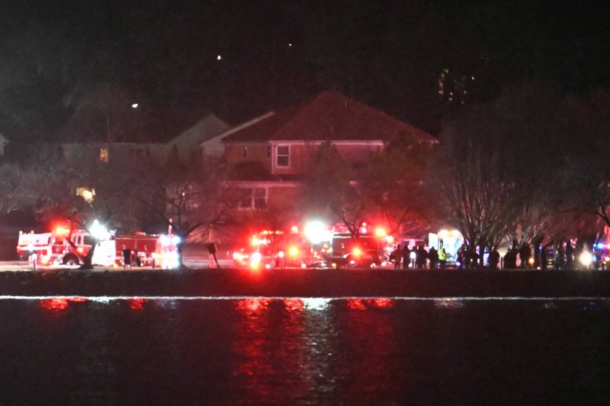Plane carrying more than 60 collides with helicopter, crashes in ...
