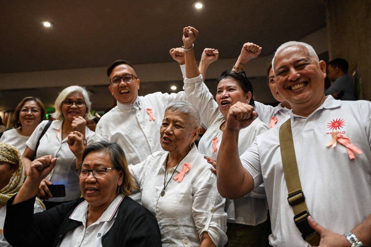 JUBILATION Lawmakers react after they voted to impeach Vice President Sara Duterte at the House of Representatives on Feb. 5, 2025. AFP PHOTO