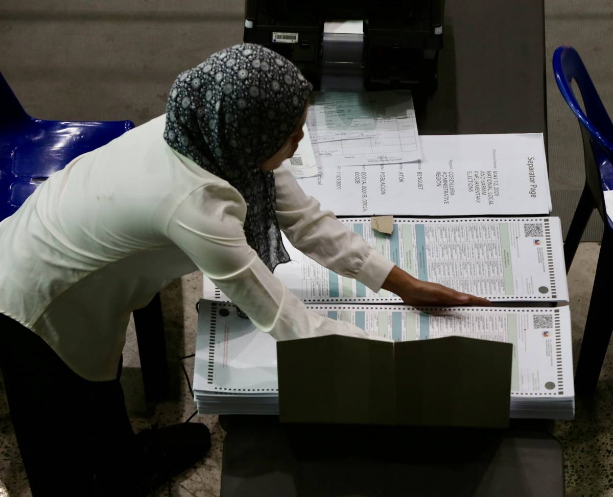 Printed ballots for the May 12 National and Local Elections undergo inspection on Feb. 14, 2025, the first day of the Commission on Elections' (Comelec's) Ballot Verification at the Amoranto Sports Complex in Quezon City. PHOTO BY ISMAEL DE JUAN