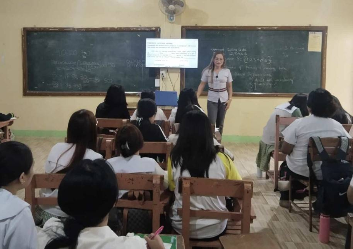 Former OFW Melinda Panerio is now a Grade 7 teacher at Bangkal National High School. CONTRIBUTED PHOTOS